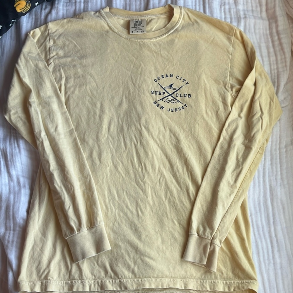 Long sleeve shirt from ocean city. Size small. Yellow and navy blue letters.
